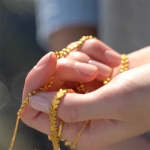 "Jungle Ivy" necklace in a girls hand